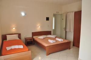Postel nebo postele na pokoji v ubytování Ostria Hotel
