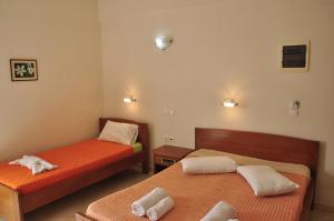 Postel nebo postele na pokoji v ubytování Ostria Hotel