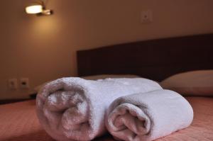 Postel nebo postele na pokoji v ubytování Ostria Hotel