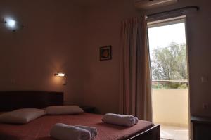 Postel nebo postele na pokoji v ubytování Ostria Hotel