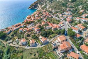 an aerial view of a village next to the ocean at Hotel L'Ogliera in Pomonte