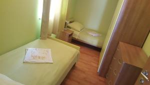 Postel nebo postele na pokoji v ubytování Apartmani Barbara App2
