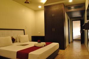 Postel nebo postele na pokoji v ubytování Hotel Sriram JB Residency + 34 fotografií