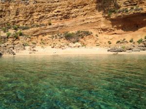 a view of a beach from the water at Apartments Banic in Rab