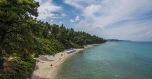 an aerial view of a beach with people in the water at Mirabilia Boutique Hotel in Kriopigi