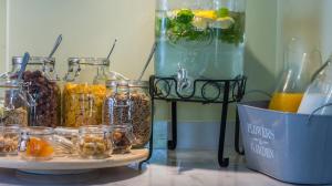 a group of jars of food on a table at Mirabilia Boutique Hotel in Kriopigi
