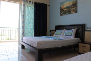 Postel nebo postele na pokoji v ubytování Hotel Aleksandrus Jardin