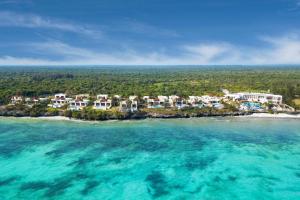 an aerial view of a resort on an island in the ocean at Moja Tuu The Luxury villas & Nature Retreat in Kiwengwa