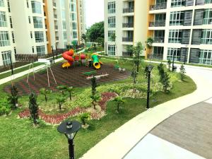 a playground in a park in front of a building at KSL Hot Spring Resort in Johor Bahru