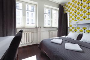 Posteľ alebo postele v izbe v ubytovaní Tatamka Hostel