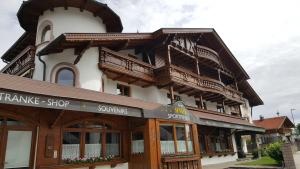 a large building with balconies on top of it at Pension Singer in Innsbruck