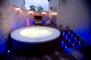 a large tub in a room with blue lights at Hillgrove Hotel, Leisure & Spa in Monaghan