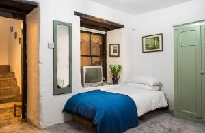 Postel nebo postele na pokoji v ubytování Cleo Gallery Apartments