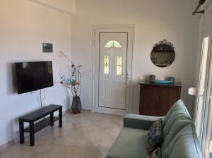 TV a/nebo společenská místnost v ubytování S&S Pura Vida Apartment