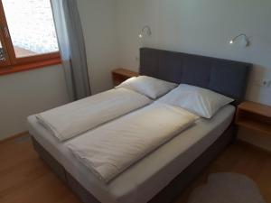 A bed or beds in a room at Appartement De Martin