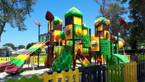 a playground in a park with a play structure at Pipo Apartment Mareda in Novigrad Istria