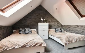Posteľ alebo postele v izbe v ubytovaní Apartament Dwupoziomowy Nad Tamami