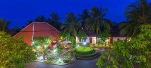an aerial view of a house with a garden at night at Alice Villa Hotel in Takeo