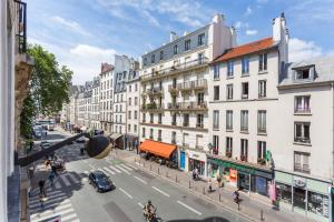 a view of a city street with buildings at CMG Saint-Antoine Bastille 6 in Paris