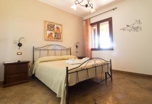 Un pat sau paturi într-o cameră la Biancolivo Gallipoli in Salento