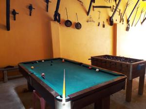 a room with a pool table with balls on it at Quinta da Moagem in Macedo de Cavaleiros