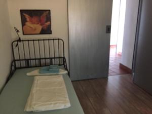 Postel nebo postele na pokoji v ubytování Mansarda Caslano
