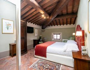 Postel nebo postele na pokoji v ubytování Palazzo Leopoldo Dimora Storica & Spa