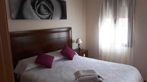 Postel nebo postele na pokoji v ubytování Toledo Magico