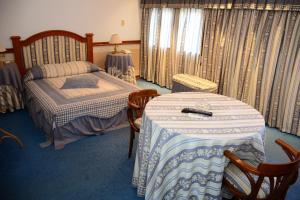Postel nebo postele na pokoji v ubytování Hotel Crown