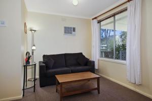 
A seating area at Snowstream Riverside Apartments - Unit 3
