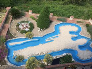 a model of a river in a garden at Guest House Panorama in Rab