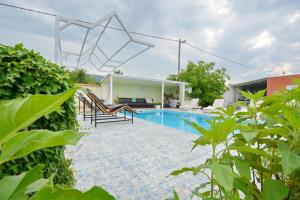 a view of a swimming pool with a house at Villa Iva in Kraj