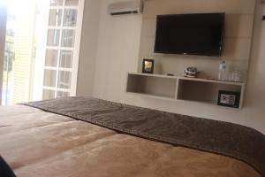 TV a/nebo společenská místnost v ubytování Casarão da Ducha hotel concept