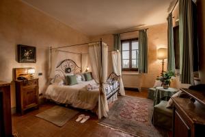 Postel nebo postele na pokoji v ubytování Agriturismo Podere La Rocca