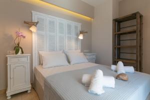 Posteľ alebo postele v izbe v ubytovaní Agorastos Suites