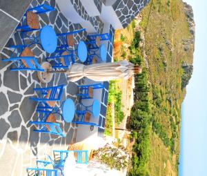 an overhead view of a building with blue roofs at Margarita Hotel in Kythira