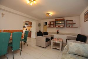 a living room with a table and chairs at Foltyn Holiday Home in Selca