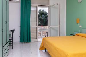 Posteľ alebo postele v izbe v ubytovaní Mini Hotel