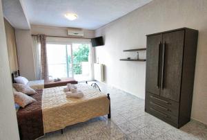 A bed or beds in a room at Arianna Studios 7