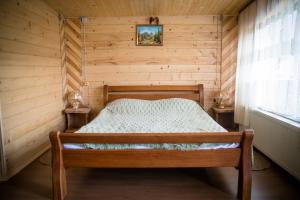 Postel nebo postele na pokoji v ubytování Kabanova Gora