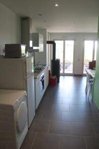 a kitchen with a stove and a stove top oven at Gite du Rocher in Hazelbourg