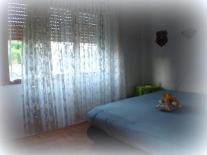 Ein Bett oder Betten in einem Zimmer der Unterkunft Holiday House Crik