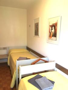 Ein Bett oder Betten in einem Zimmer der Unterkunft La finestra sulle Dolomiti - The Window to the Dolomites