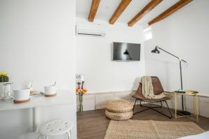 a room with white walls and a table and chairs at Villa Lucia in Trogir