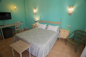 Postel nebo postele na pokoji v ubytování Hotel La Posada De Paco - Spa & Adults Friendly