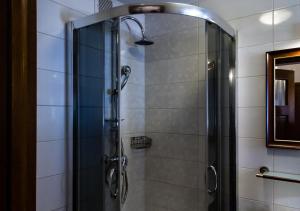 a shower with a glass door in a bathroom at Lublin Apartaments in Lublin +91 photos