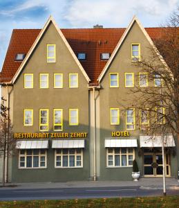 
a large brick building with a large window at Hotel Zeller Zehnt in Esslingen
