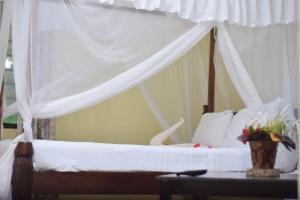 Postel nebo postele na pokoji v ubytování Coral Beach Resort