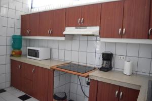 Kuchyň nebo kuchyňský kout v ubytování Alojamiento Castelnouvo, Entre Ríos, Guayaquil, Ecuador