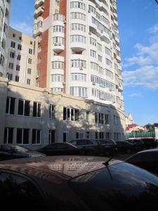 a car parked in front of a tall building at Apartment Arkadiya, three bedrooms! in Odesa